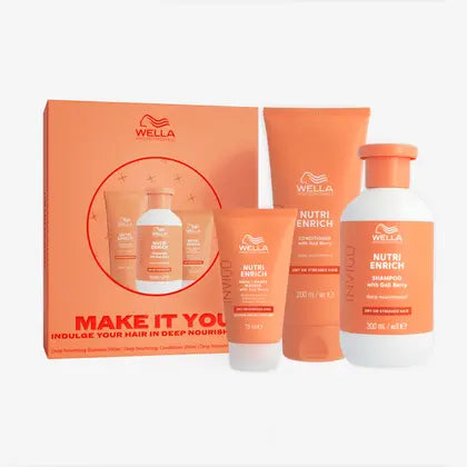 Wella Nutri Enrich Hair Care Set featuring an orange gift box, a tube, a small squeeze bottle, and a shampoo bottle, all in orange and white packaging on a light gray background.